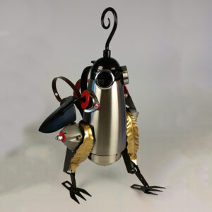 A quail constructed with a coffee pot and garden clippers