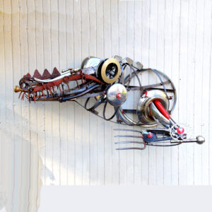 A crocodile made of rakes, bicycle and lamp parts and other miscellaneous steel pats.