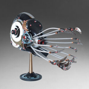 A nautilus constructed of lamp parts, a fan, wire and garden tools