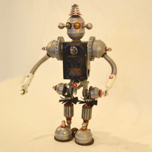 Robbie is made of lamp and fence post parts, a file alarm box and various machine parts.