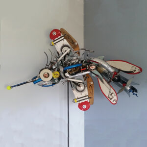 This mosquito is constructed with airplane parts, an airplane engine and wing parts.