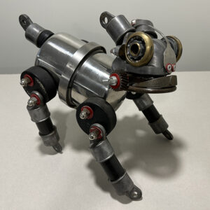 Dog made with fence parts, pressure tank, hocky pucks and various machine parts.