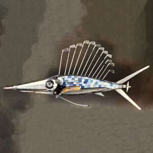 A fish constructed of golf clubs, formica chips, hockey sticks, and various machine parts.